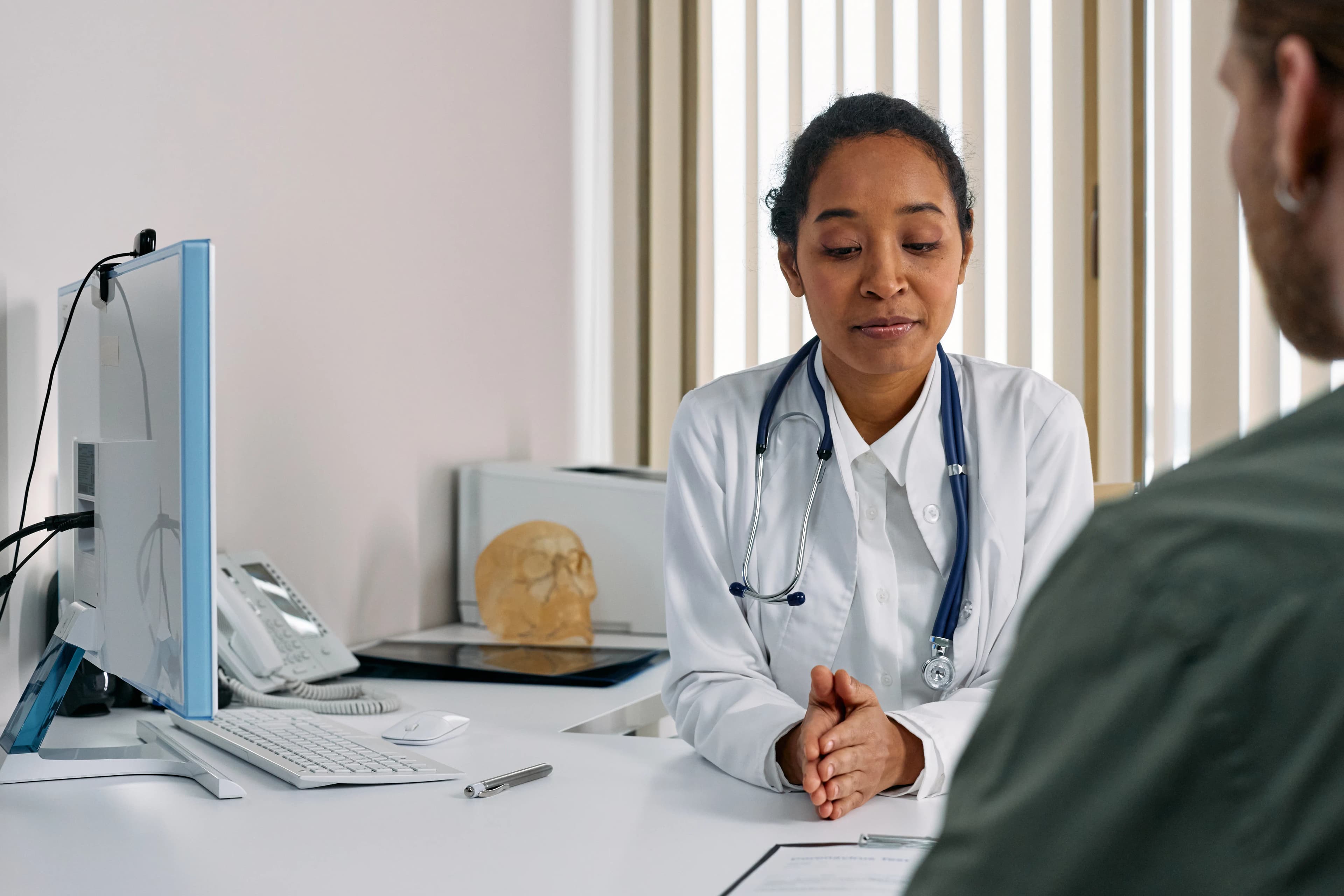 Physician talking with a patient in a modern clinic