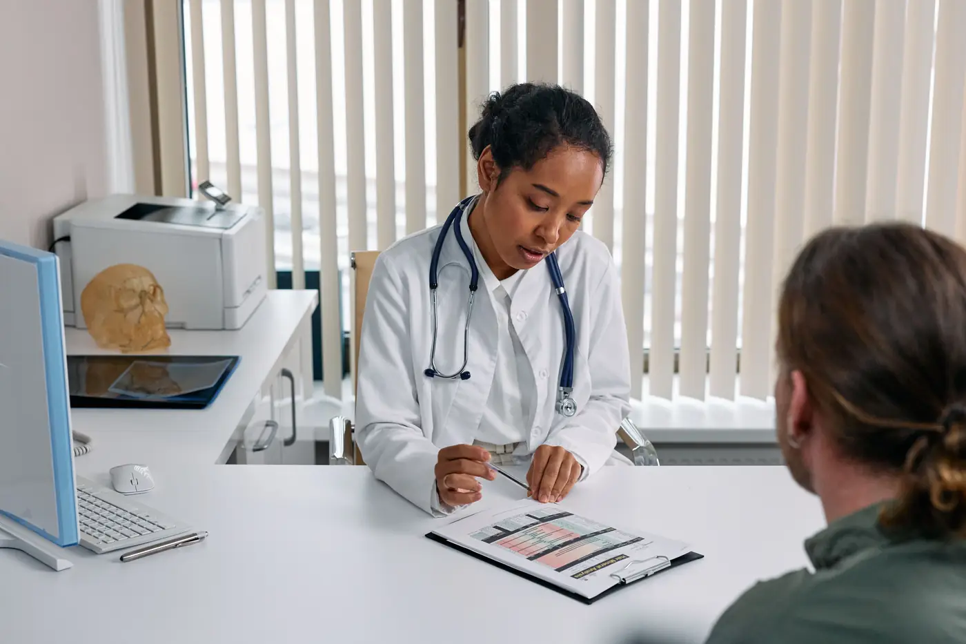 A private-practice clinician speaking with a patient