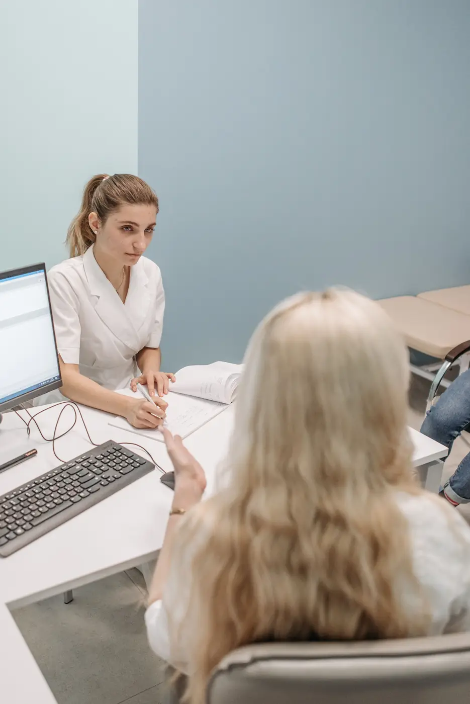 Two clinicians discussing practice operations in a private office