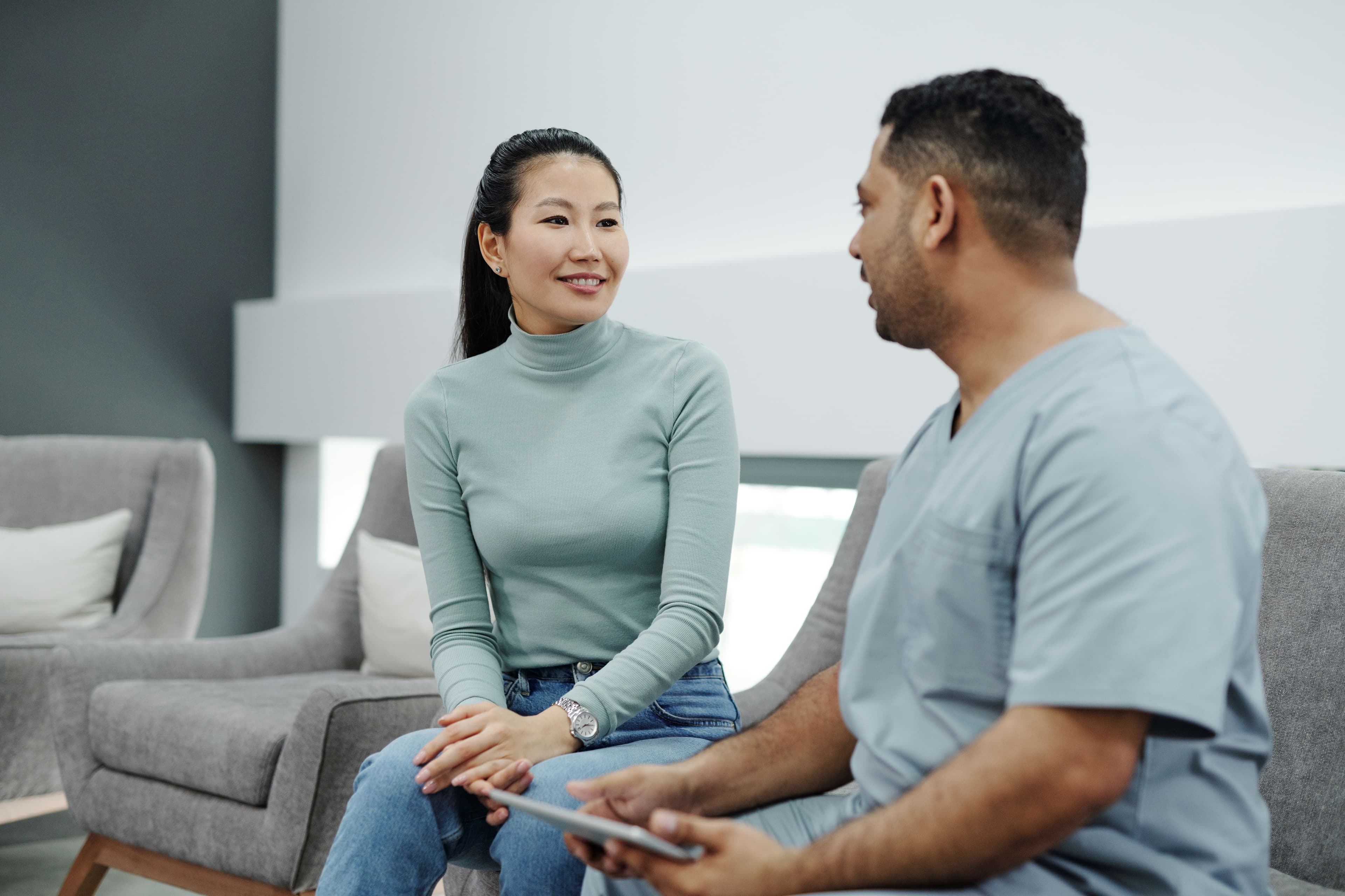 Doctor listening to a patient during an in-person consultation